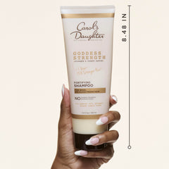 Goddess Strength de Carol's Daughter, botella con aceites nutre cabellos rizados y frágiles.