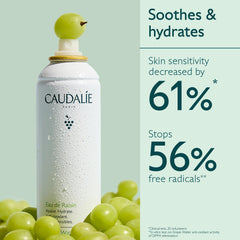 Caudalie Grape Water Mist spray in action, cooling the skin with refreshing vapor.