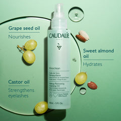 Massaging Vinoclean oil onto dry skin to dissolve makeup.