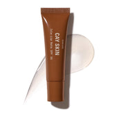 Cay Skin Isle Lip Balm SPF 30 con brillo translúcido para labios hidratados.