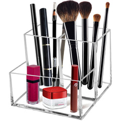 Cerpourt clear acrylic makeup brush organizer with three slots for easy access.