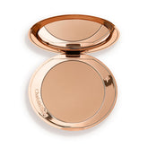 Charlotte Tilbury Airbrush Bronzer Fair compact with a soft matte finish and pore-blurring effect.