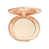 Charlotte Tilbury Airbrush Flawless Finish front compact for shine control and soft-focus glow.