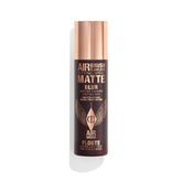 Charlotte Tilbury Airbrush Flawless setting spray bottle primes and locks makeup all day.