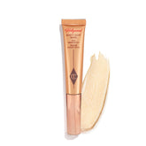 Charlotte Tilbury Beauty Light Wand Spotlight delivers a pearlescent glow on cheekbones.