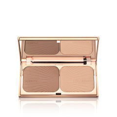 Charlotte Tilbury Filmstar Bronze & Glow highlighter glow on cheekbones.