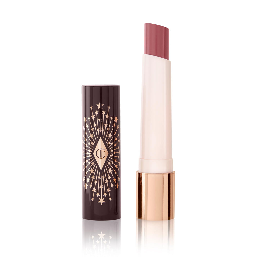 Charlotte Tilbury Hyaluronic Happikiss Pillow Talk closeup highlights dewy, hydrating nude-pink lips.