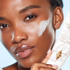 Cream-to-foam-to-milk texture of Charlotte Tilbury Magic Hydration Revival Cleanser shown.