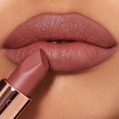 Nude-rose shade flatters many skin tones and complements makeup.