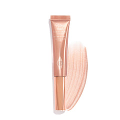 Charlotte Tilbury Pillow Talk Beauty Light Wand close-up for precise glow on cheeks.