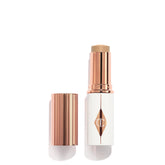 Charlotte Tilbury Unreal Skin Tint Stick application shows seamless, weightless coverage