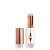 Charlotte Tilbury Unreal Skin Tint Stick closeup showing creamy, hydrating texture for natural glow.