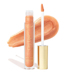 City Lips Nude York gloss tube shows high-shine nude shade with gold glitter.