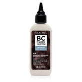 Clairol Professional Advanced Gray Solution bottle pouring for precise gray coverage