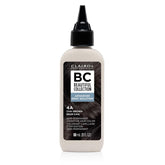 Clairol Professional Advanced Gray Solution bottle closeup shows a no ammonia, no peroxide formula for gentle gray coverage.