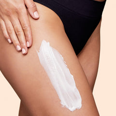 Box and tube of Clarins Body Partner Stretch Mark Expert packaging highlights fragrance-free, minimal ingredients