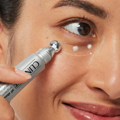 Clinique All About Eyes Brightening Serum Concentrate applicator showing precise under-eye targeting.