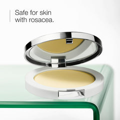 Close-up of powder being applied to calm flushed skin with color correction
