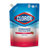 Clorox hand soap refill pouring into a dispenser with strawberry scent.