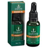 Clubman Pre Shave Oil bottle pour demonstrates smooth application for razor glide.