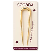Cobana gold French Hair Pin securing a neat bun for a polished look.