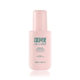 Coco & Eve Like A Virgin Frizz Fix bottle pour for controlled, frizz-free application.