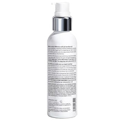 Color Wow Dream Cocktail bottle pour captured for easy product dispersion during styling.