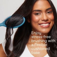 Close-up of Conair detangling brush showing soft ball-tipped bristles for gentle detangling.