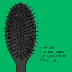 Conair Men detangler brush in action for everyday grooming across hair types.