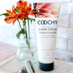 Texture close-up showing silky glide and hair-softening action of Coochy cream.
