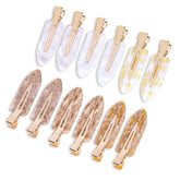 Cptots No Crease flat clip in white gold keeps hair smooth and marks-free all day.