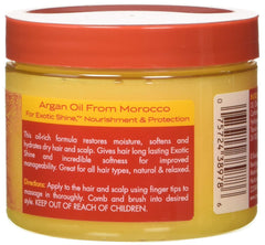 Creme of Nature Argan Oil Day & Night bottle being poured for easy daily use