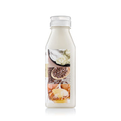 Close-up of Creme of Nature bottle label with Butter Blend and flaxseed-argan benefits.