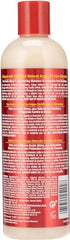 Creamy texture closeup of Creme of Nature Intensive Conditioning Treatment for hydrated hair