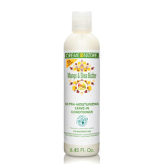 Botella de Creme of Nature Mango y Shea Butter, ideal para hidratación diaria.
