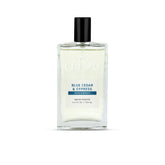 Cremo Blue Cedar and Cypress bottle front view highlights refined daily scent