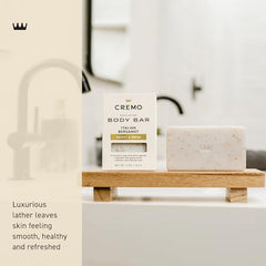 Cremo Exfoliating Body Bar oat kernel scrub improves cleansing while leaving skin moisturized.
