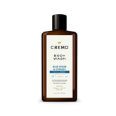 Cremo rich-lathering Cypress and Cedar body wash bottle delivers a luxurious cleanse.