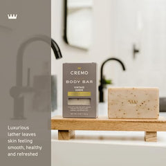 Cremo Vintage Suede body bar oat kernel exfoliation for gentle buffing.