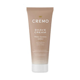 Cremo Women's Shaving Cream bottle with amber jasmine scent enhances smooth, irritation-free shaving.