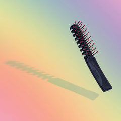 Cricket Static Free Volumizer Brush stay-put ball tips prevent snags during styling.