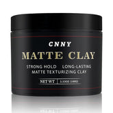 Crownnaturally CNNY arcilla para peinar con acabado mate y control duradero.