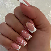 CTTHNBD square press-on nails with white French tip and heart stripes for an easy at-home manicure.