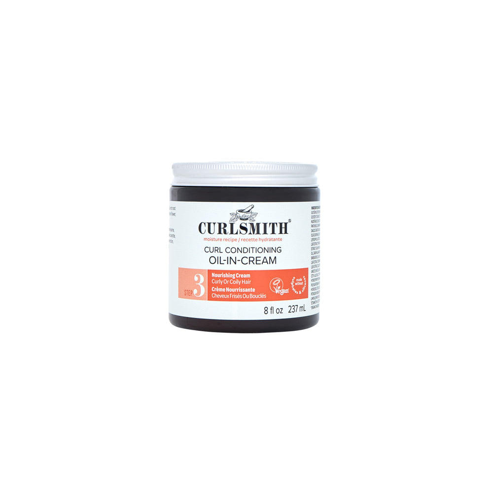 Curlsmith Curl Conditioning Oil in Cream bottle pour showing rich moisture for hydrated curls