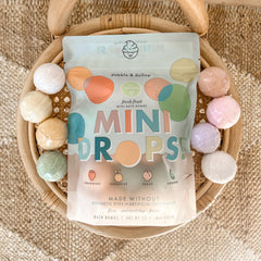 Dabble & Dollop peach-scent mini bath bomb delivering gentle moisture.