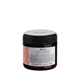Davines Alchemic Copper conditioner bottle highlighting copper tones for cool red hair.