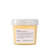 Davines DEDE conditioner bottle pour shows lightweight daily conditioning for fine hair.