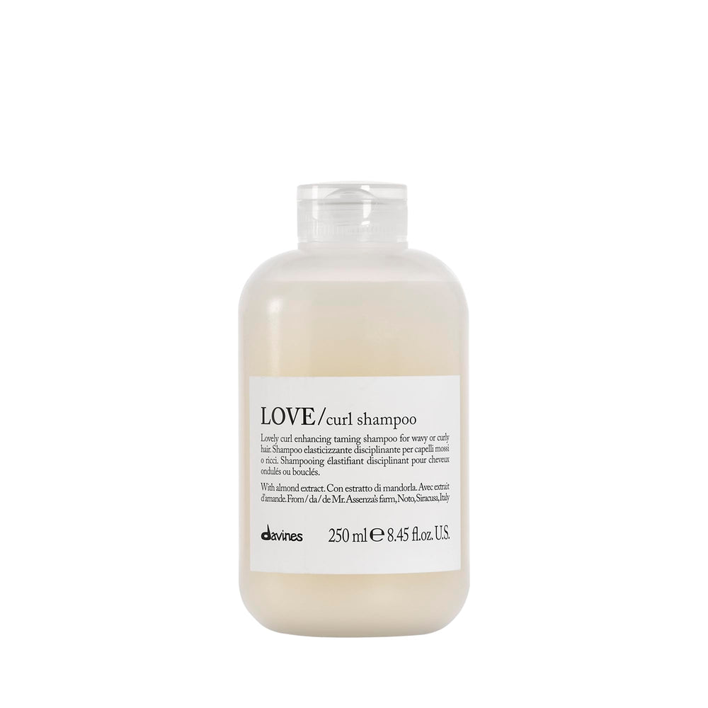 Davines LOVE Curl Shampoo bottle on bathroom shelf for curl definition.