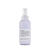 Davines LOVE smoothing perfector serum bottle highlights anti-frizz protection for coarse hair.
