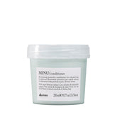 Davines MINU bottle front shows color-protecting conditioner for color-treated hair.